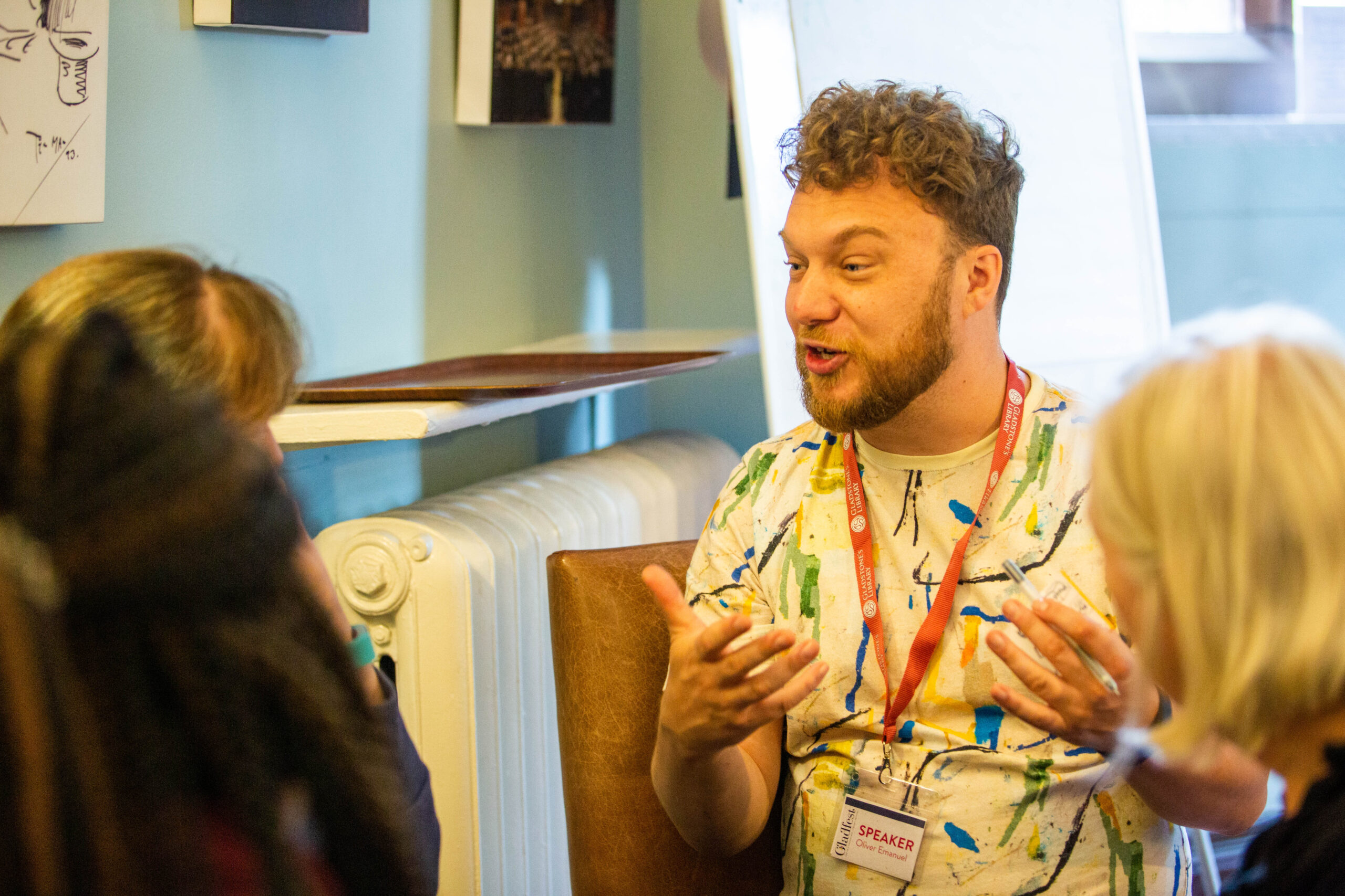 A picture of Oliver Emanuel, an energetic-looking man speaking to class attendees in a room at Gladstone's Library