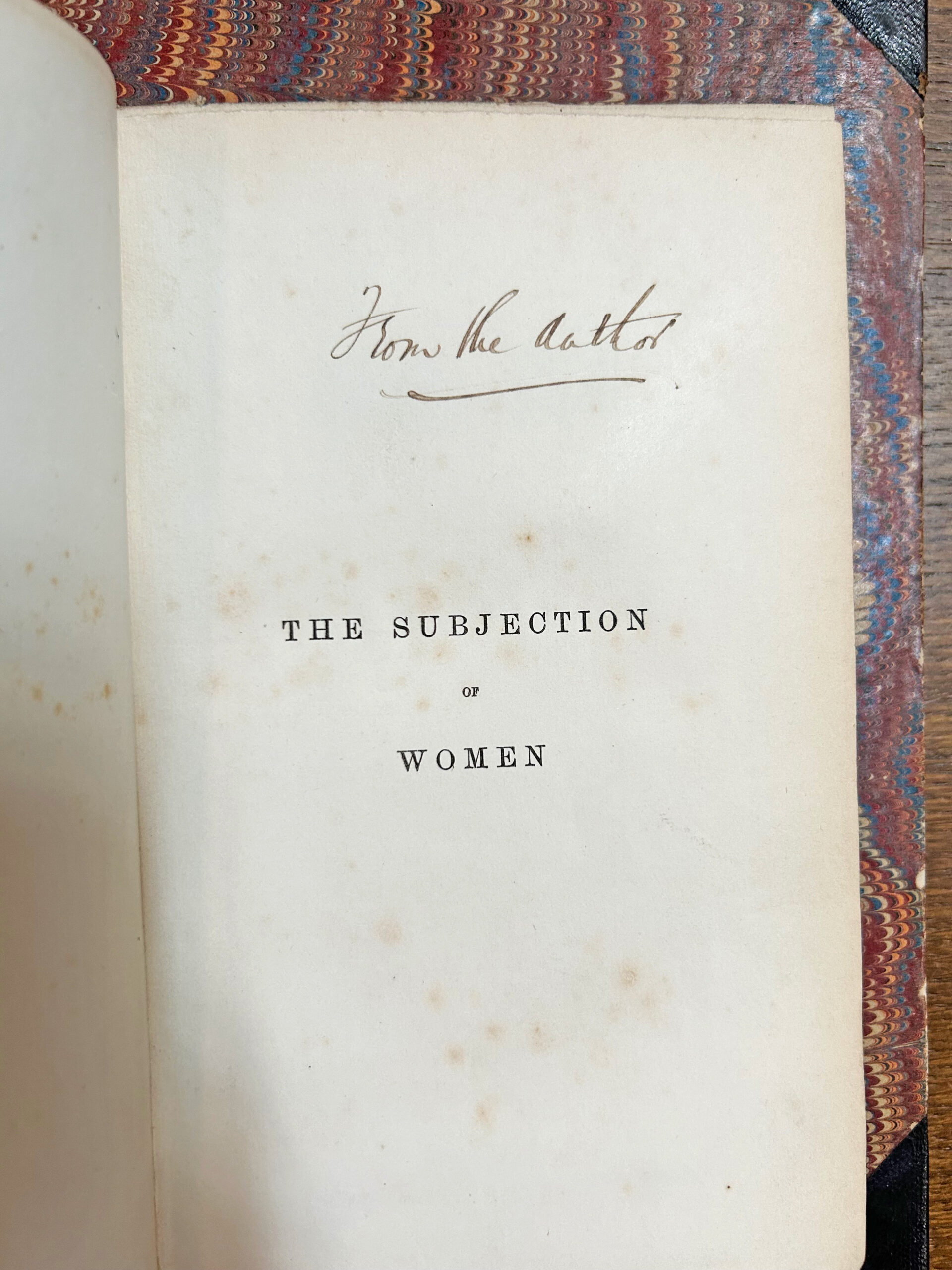 The title page from 'The Subjugation of Woman'. The title is the only printed text on the page. There is a handwritten note: from the author